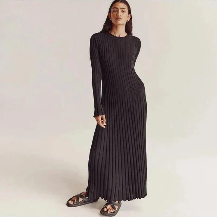 Timeless elegant pleated knit dress in black, perfect for summer office wear with a sophisticated and comfortable design.