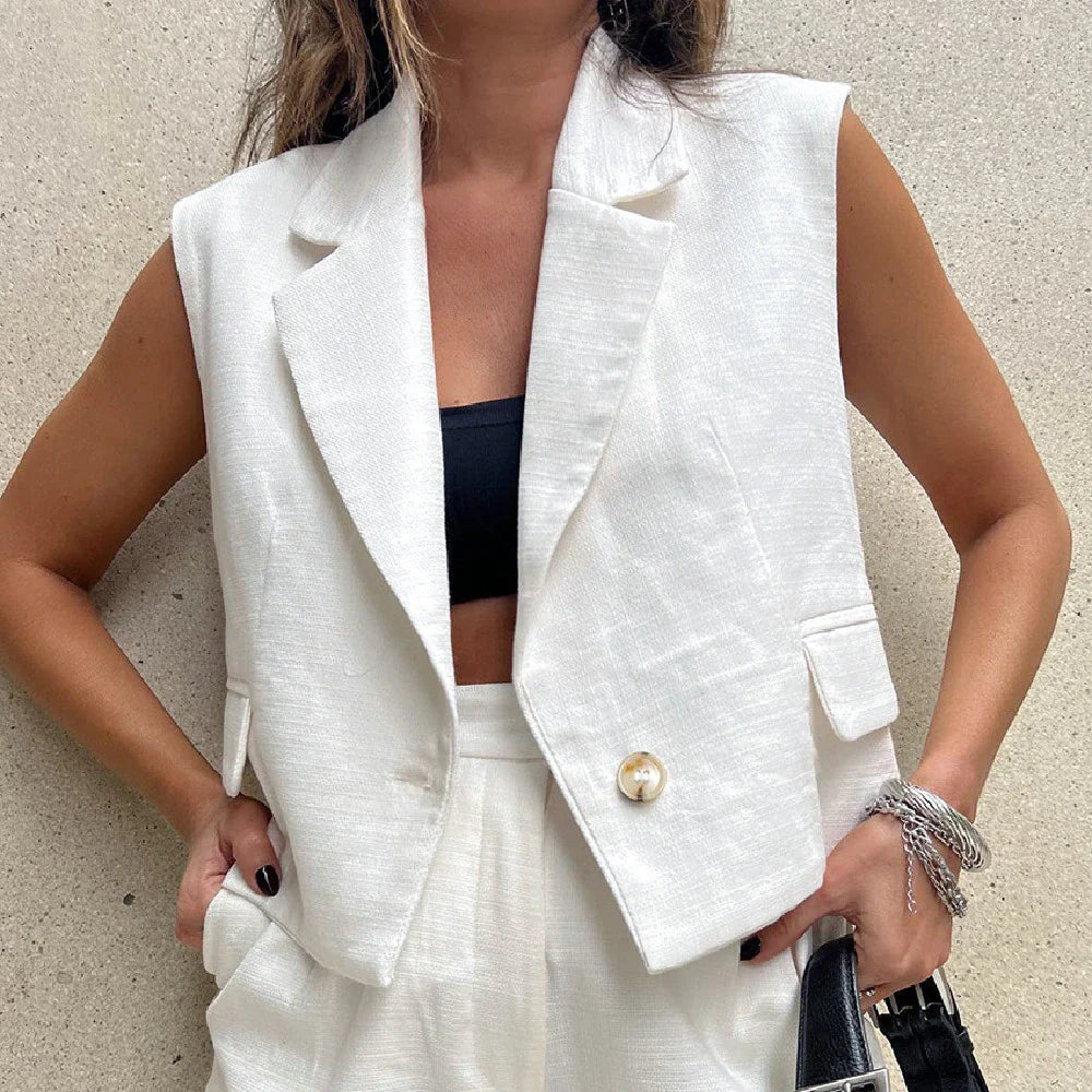 Fashionable white tailored collar vest and matching shorts set with stitched details for a refined, versatile look