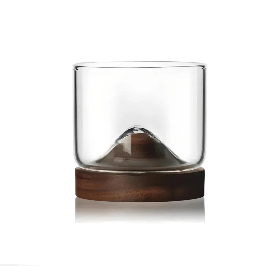 Elegant mountain-inspired whiskey glass with a wooden base, perfect for enjoying a variety of hot and cold beverages
