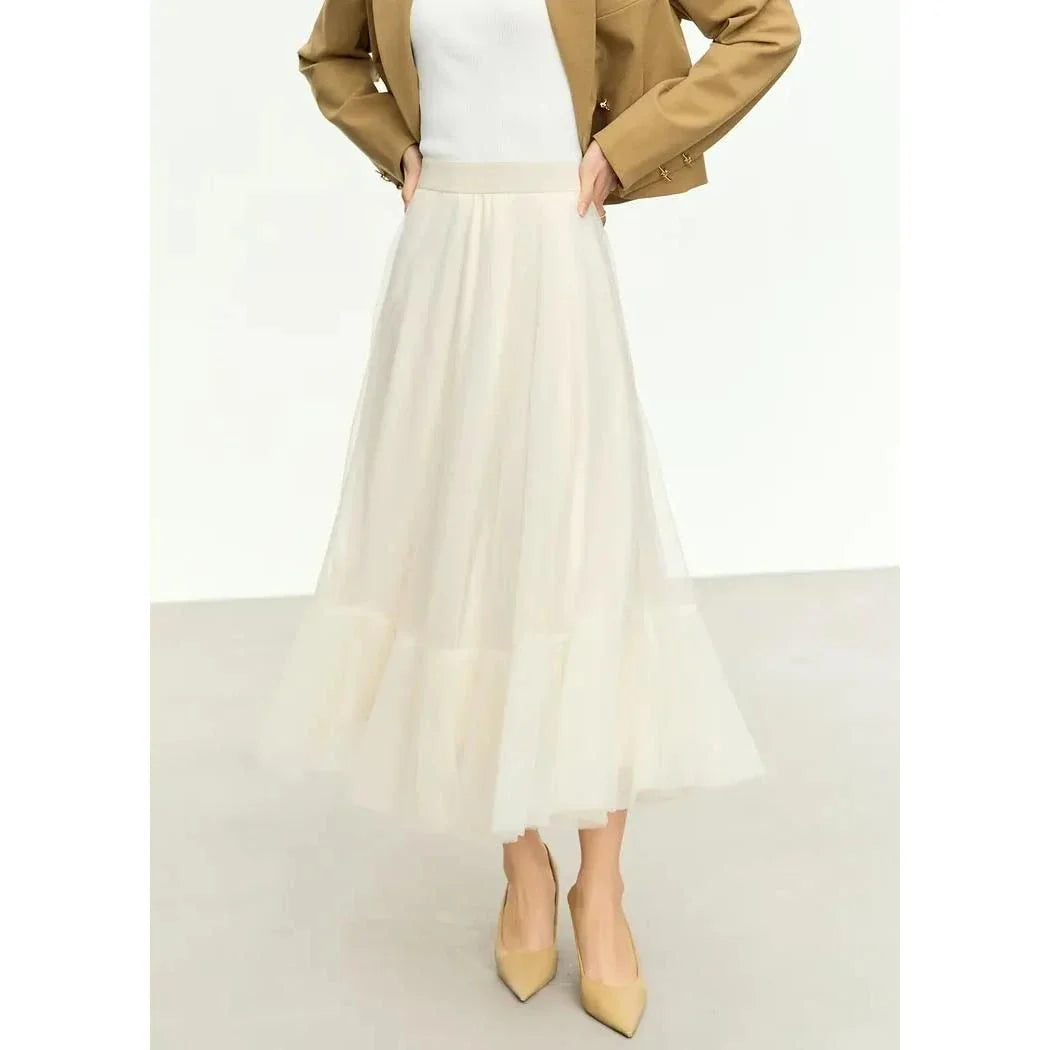 Elegant gauze A-line skirt in beige and white colors, featuring a graceful ankle-length design and unique patchwork detailing for a sophisticated look.