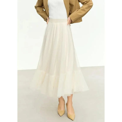 Elegant gauze A-line skirt in beige and white colors, featuring a graceful ankle-length design and unique patchwork detailing for a sophisticated look.