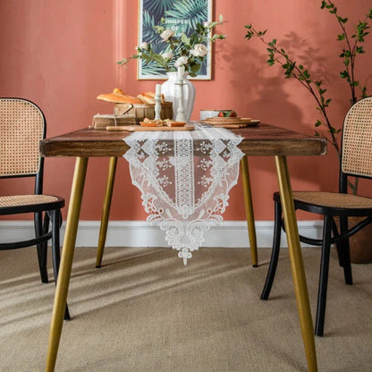 Elegant and refined lace table runner with intricate embroidery and hollowed-out patterns, perfect for sophisticated dining experiences