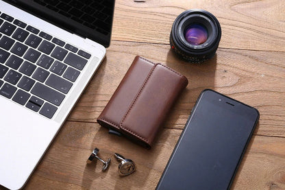 Stylish men's tri-fold wallet made of premium PU leather with magnetic buckle closure and multiple compartments for organization