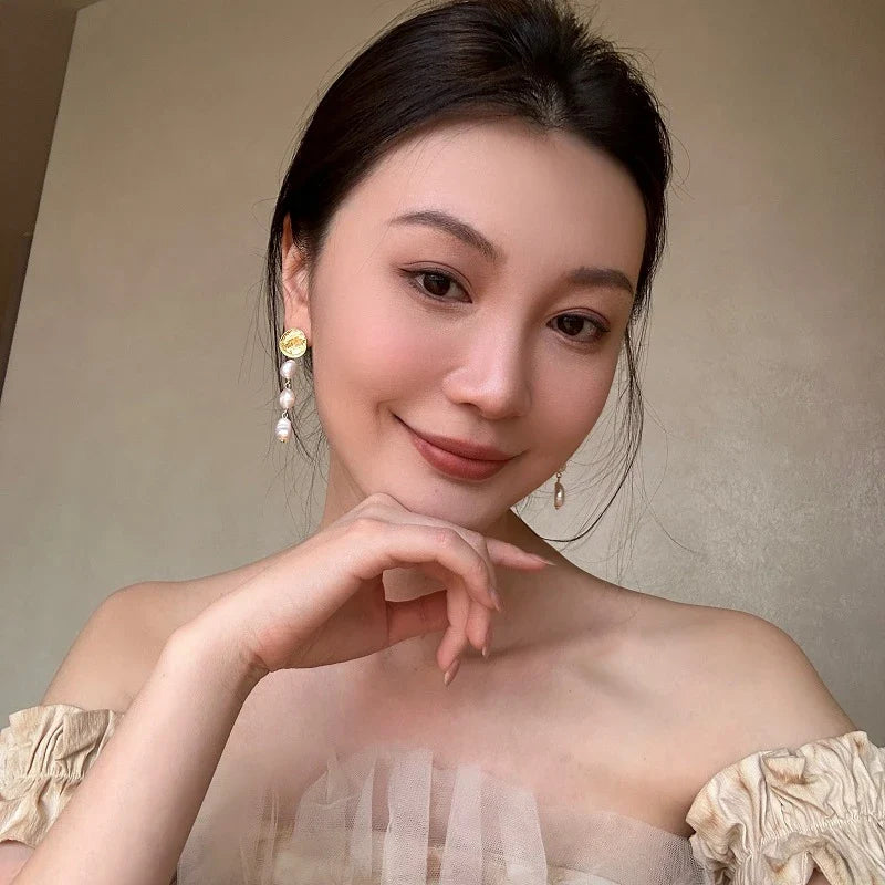 Elegant gold coin long earrings with a luxurious, statement-making design