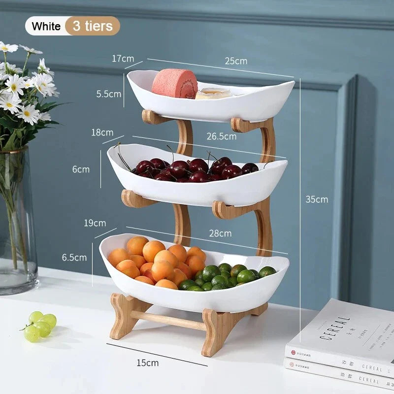 Three-tier plastic and bamboo fruit display tray with unique leaf-shaped design, available in white, beige, and green colors