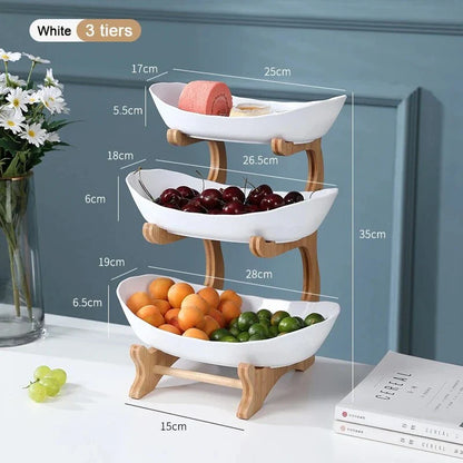 Three-tier plastic and bamboo fruit display tray with unique leaf-shaped design, available in white, beige, and green colors
