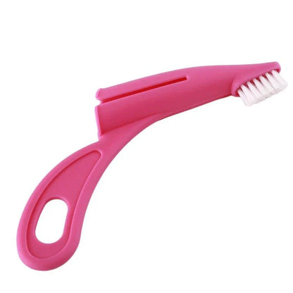 An ergonomic finger toothbrush designed for easy and effective pet dental care, featuring soft bristles and a comfortable grip.