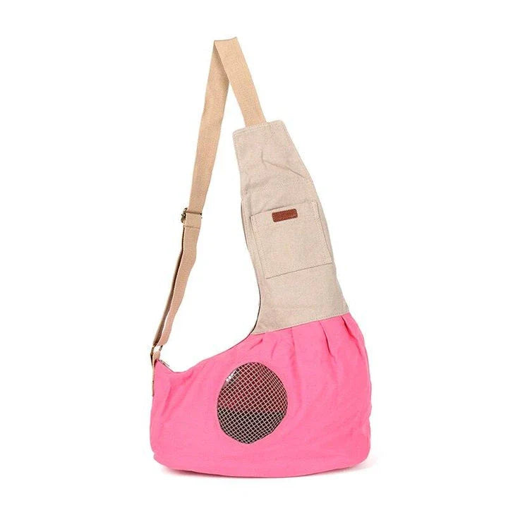 Breathable canvas crossbody carrier for pets with adjustable strap and roomy interior