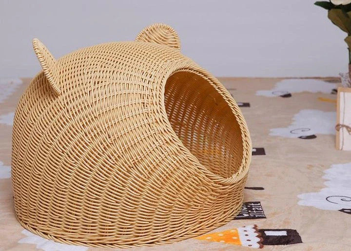 A cozy round woven pet bed made of premium wicker with a soft, plush interior for maximum comfort and style.