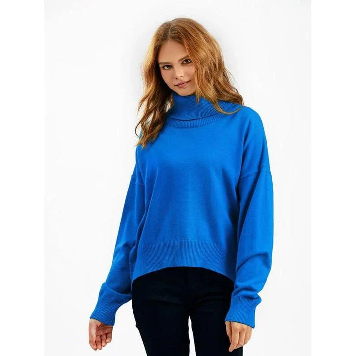 Chic and cozy oversized turtleneck sweater for women in a solid color, perfect for cold weather fashion and style