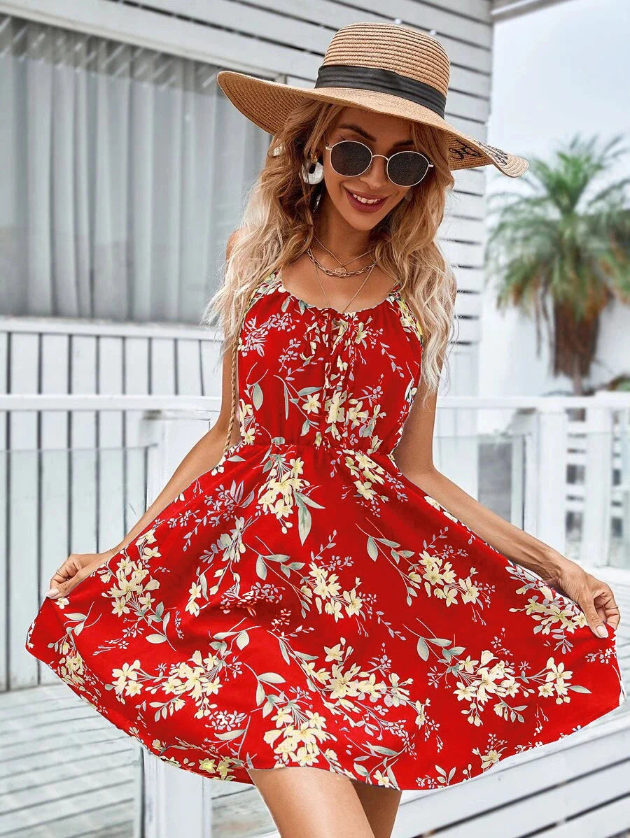 A stylish floral print suspender dress with an elastic waist, perfect for summer fashion and casual or dressy occasions.