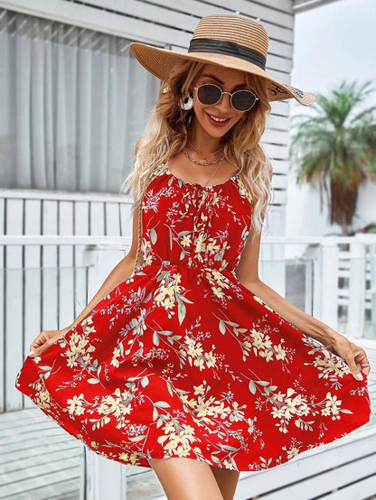 A stylish floral print suspender dress with an elastic waist, perfect for summer fashion and casual or dressy occasions.