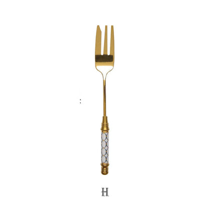 Elegant gold-plated dessert fork with intricate ceramic handle design