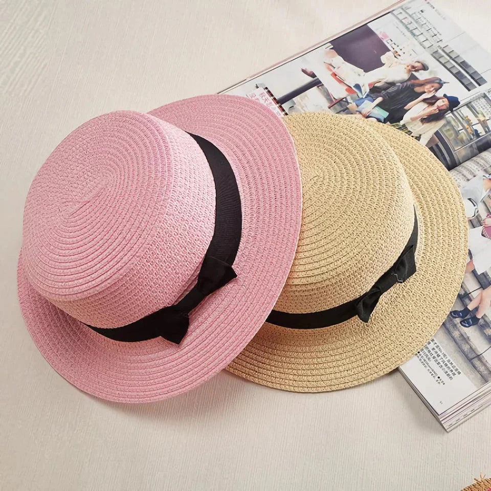 Classic straw Panama hat with a bow detail, offering sun protection and fashionable summer style