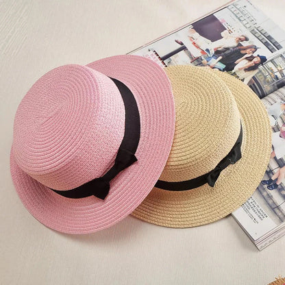 Classic straw Panama hat with a bow detail, offering sun protection and fashionable summer style