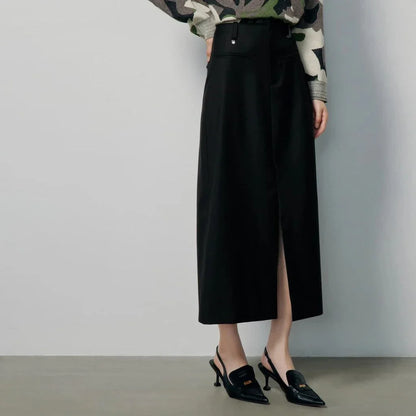 High-waisted slim-fit black midi skirt with metallic decoration, sequin detailing, and split hem