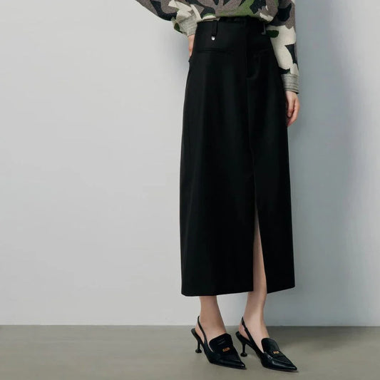 High-waisted slim-fit black midi skirt with metallic decoration, sequin detailing, and split hem