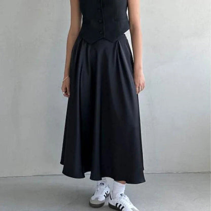 Elegant high-waisted satin maxi skirt in black for women, showcasing a flowing, sophisticated silhouette.