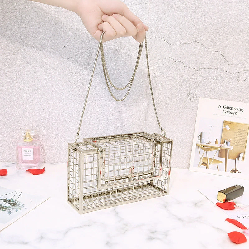 Metal shoulder bag with iron mesh design, adjustable chain strap, and compact size for versatile wear