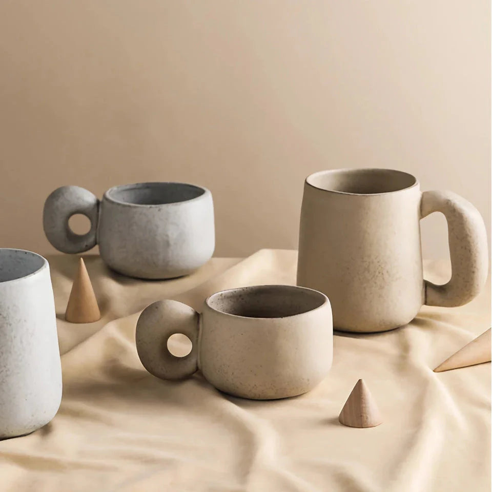 Handcrafted Japanese stoneware retro coffee mug in apricot and grey colors with a comfortable grip and minimalist design
