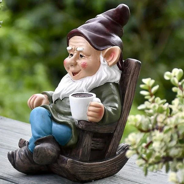 Charming outdoor garden gnome decoration made of durable resin, featuring a relaxing gnome on a rocking chair