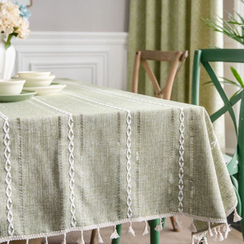 Elegant hollowed-out green tablecloth with a sophisticated and rustic design, perfect for American-style dining and events