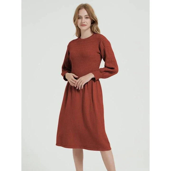 Elegant long sleeve knitted sweater dress in purple red with a classic A-line silhouette and mid-calf length