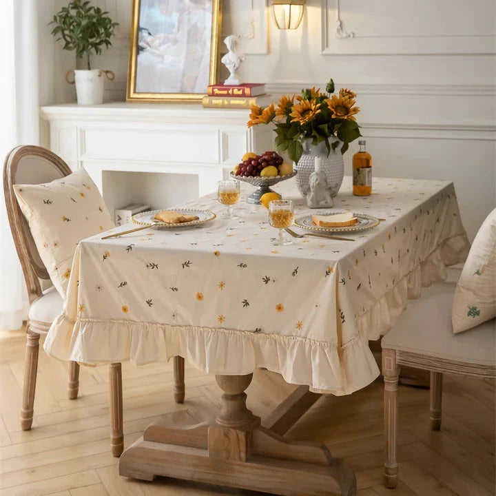Elegant cotton tablecloth with apricot embroidery and lotus leaf edge, perfect for dining decor