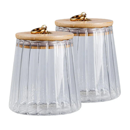 Elegant glass canisters with flower-shaped metal handles and airtight bamboo lids for stylish kitchen storage