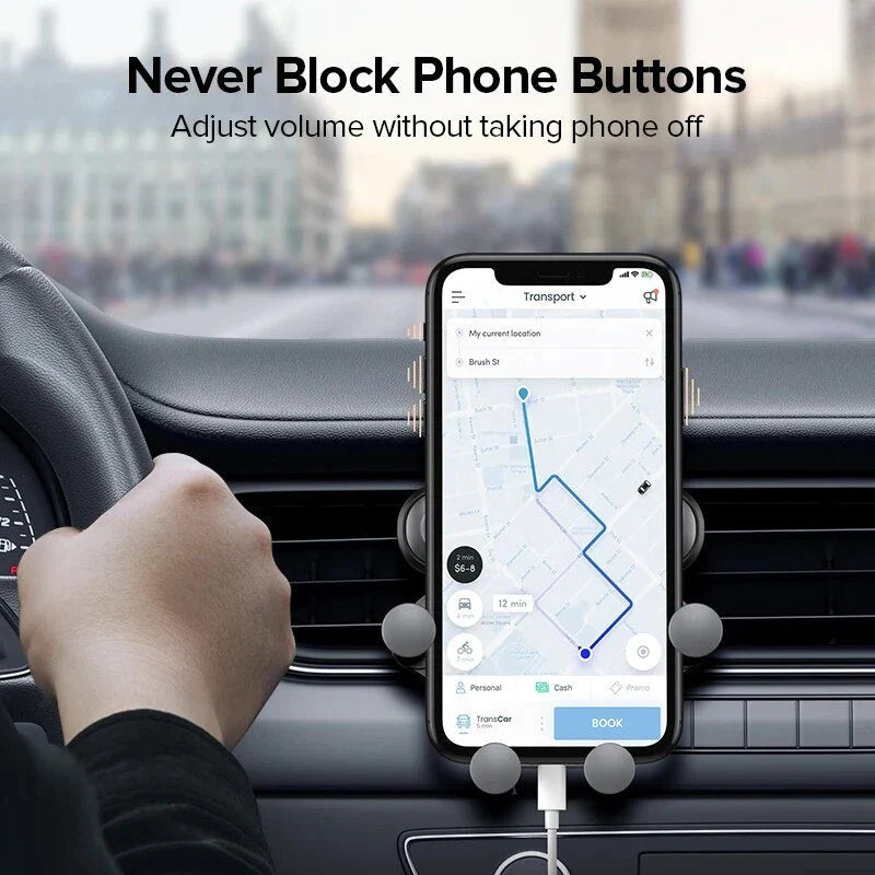 Gravity-powered car phone holder with air vent mount, securely holding a smartphone in place