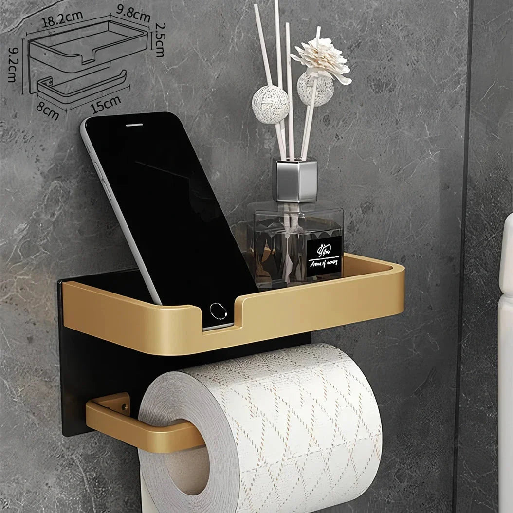 Black and gold aluminum bathroom paper holder with a convenient phone shelf, a stylish and functional accessory for modern bathrooms.