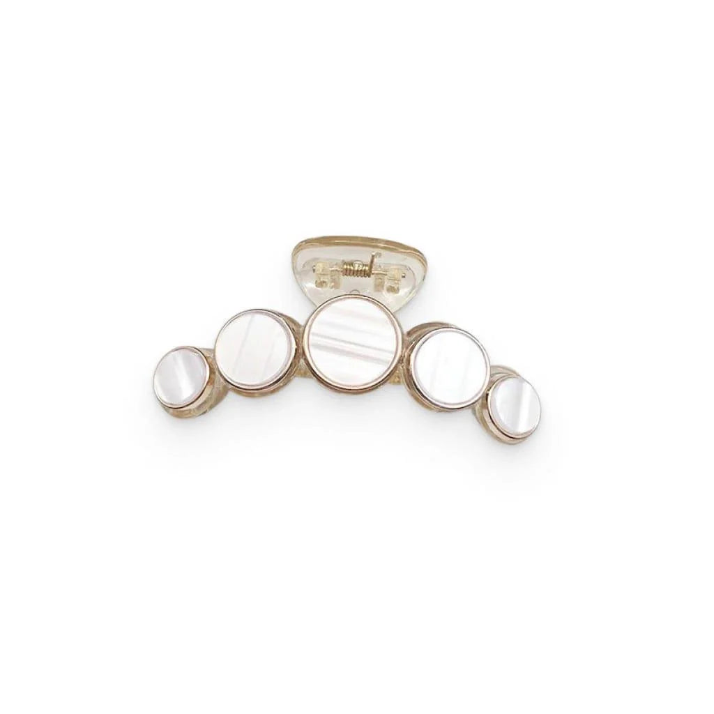 Elegant white marble circle hair claws that add a chic, fashionable touch to any hairstyle