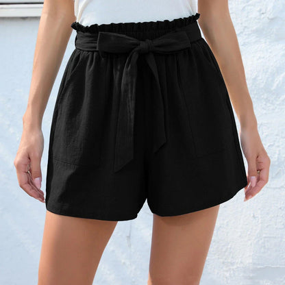 Ruffle bow waist tie shorts in black, made of lightweight and breathable polyester fabric, with convenient pockets for storage