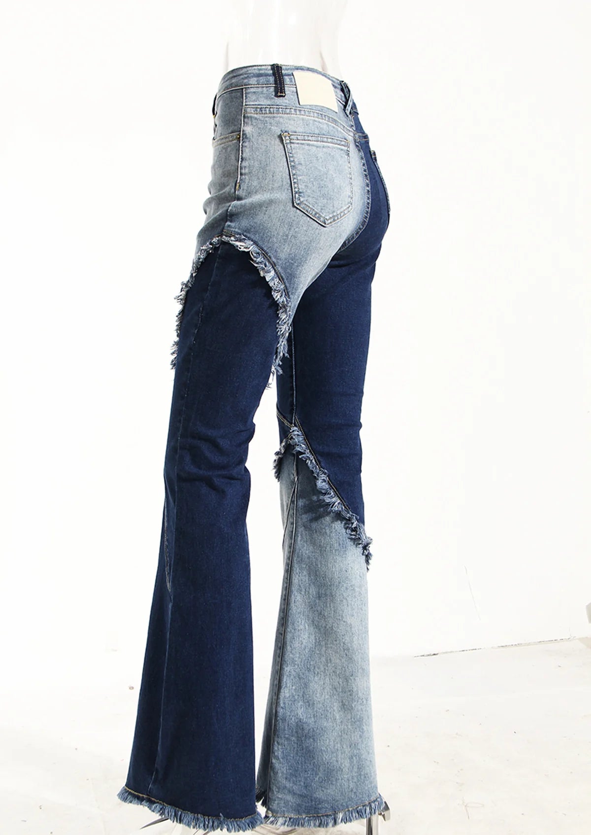 Geometric raw edge jeans with high-waisted, slimming design in blue denim