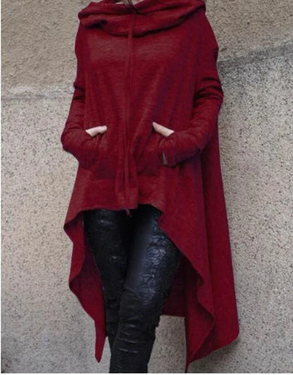 A cozy, loose-fit hooded sweatshirt in a stylish dark grey color, perfect for staying warm and comfortable during the fall and winter seasons.