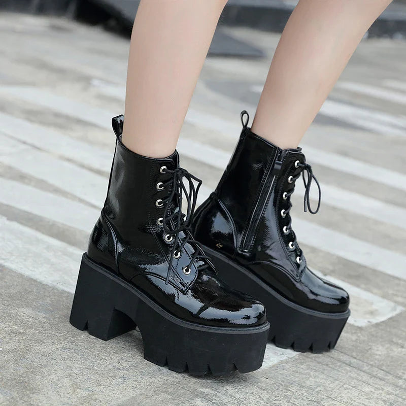 A pair of stylish lace-up high heel boots in black, featuring a sleek design and microfiber interior for comfort.