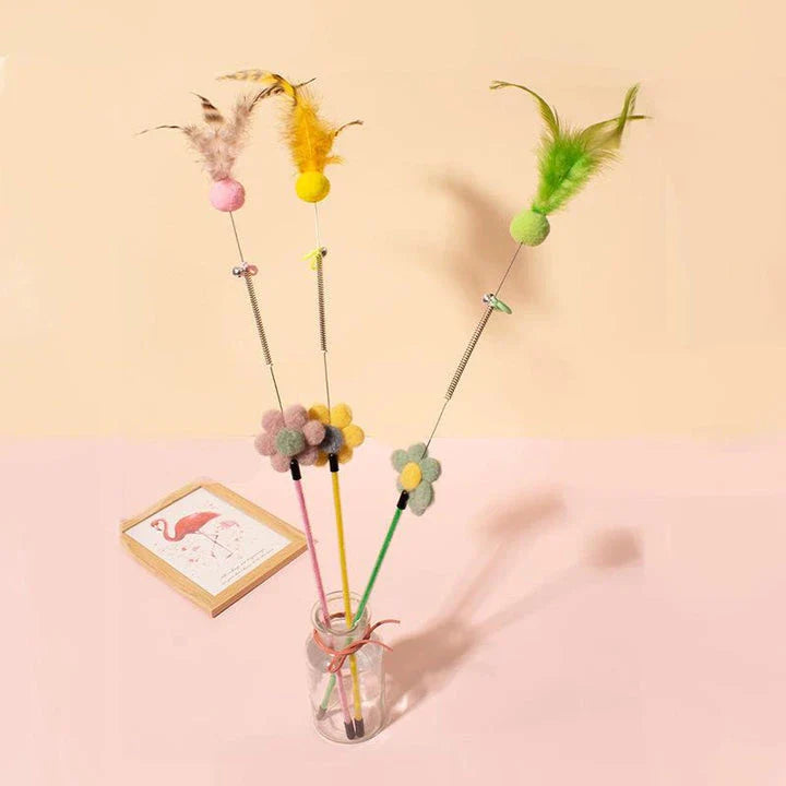 Interactive cat toy with furry ball, feathers, and bell for engaging playtime and exercise