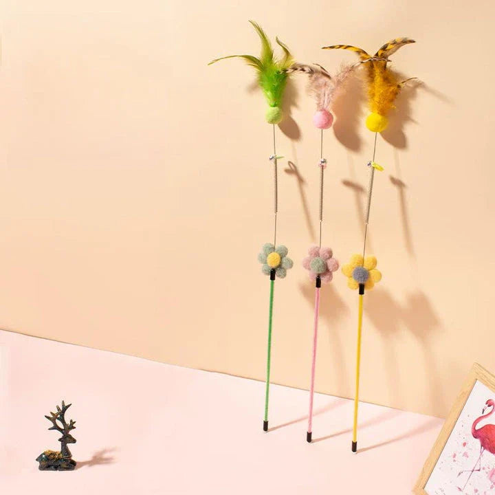 Interactive cat toy with furry ball, feathers, and bell for engaging playtime and exercise