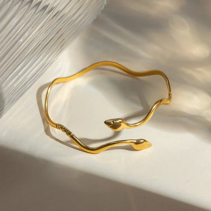 18K gold-plated stainless steel wavy snake bracelet with vintage-inspired design and open cuff style