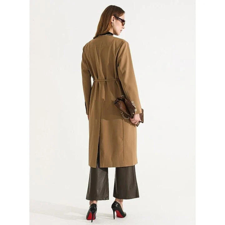 Women's full-length trench coat with lace-up waist, turn-down collar, and elegant full sleeves