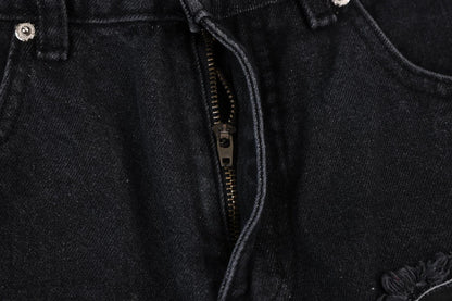 Premium loose fit distressed denim trousers for men and women, featuring a relaxed silhouette, high-quality cotton construction, and trendy distressed details.