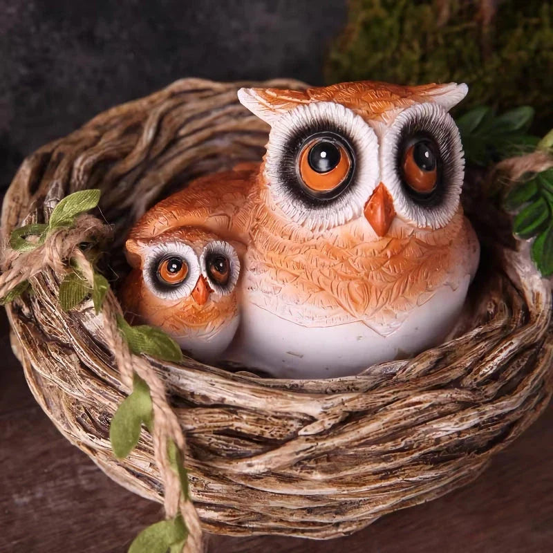 High-quality resin sculpture of a mother owl and her baby nestled in a cozy nest, perfect for adding natural charm to home and garden decor