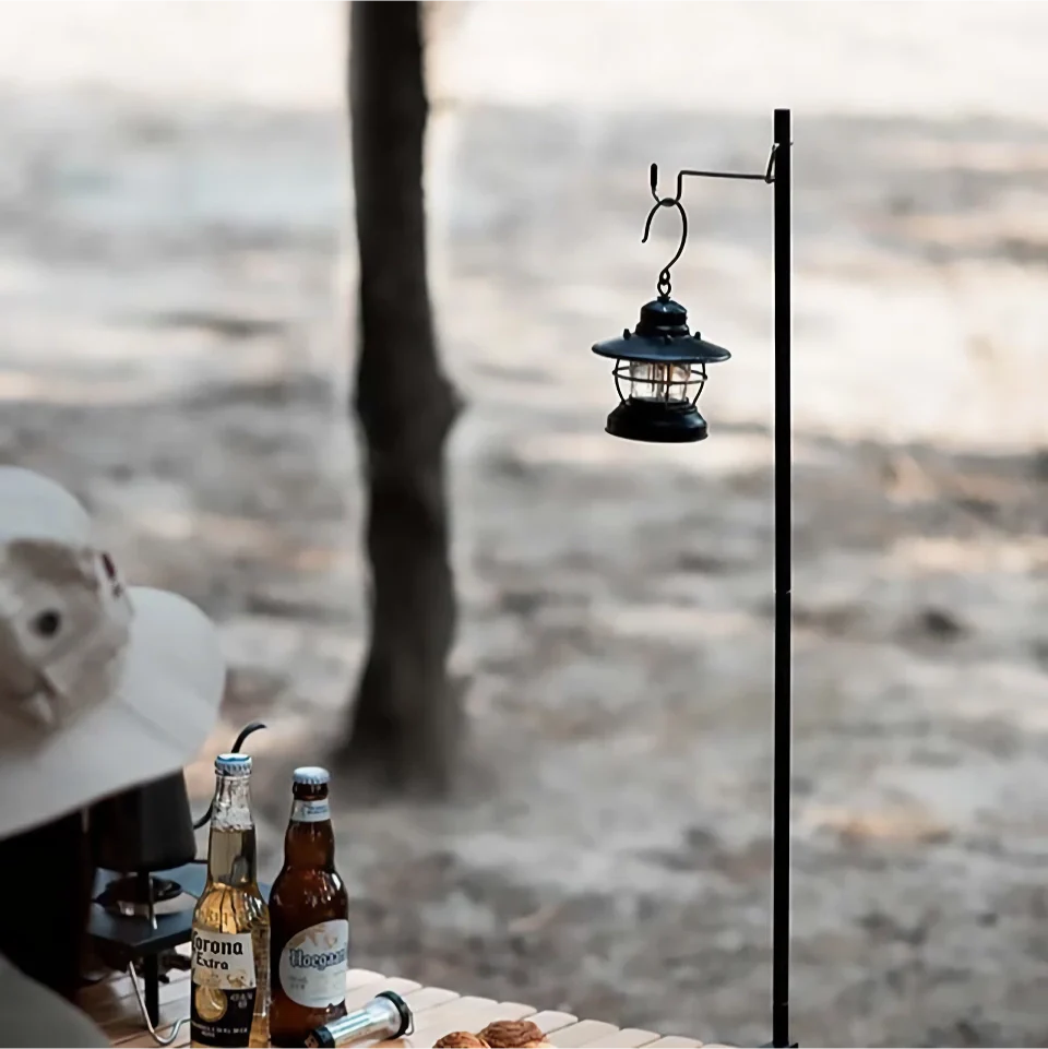 Adjustable camping lantern stand with detachable hooks for stable and elevated outdoor lighting