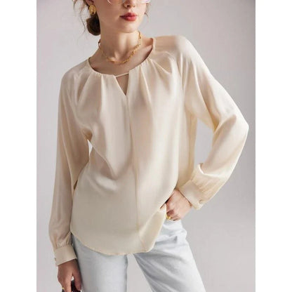 Elegant silk blend raglan sleeve blouse with timeless design and flattering fit for modern women