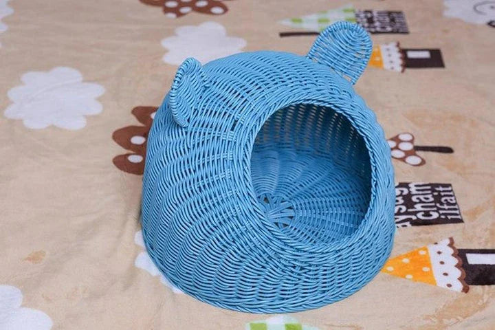 A cozy round woven pet bed made of premium wicker with a soft, plush interior for maximum comfort and style.