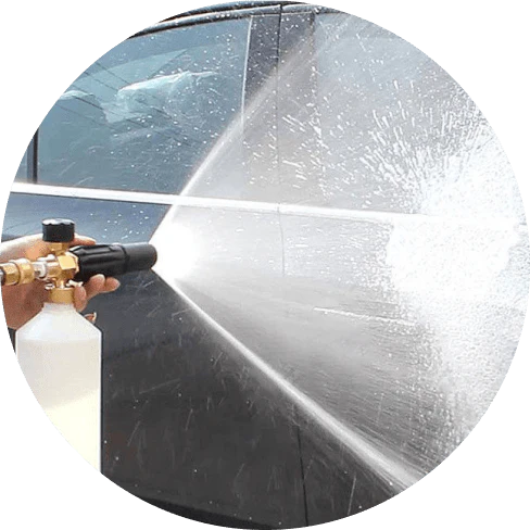 A compact, plastic car wash foam-generating tank with a copper connector to attach to a standard garden hose.