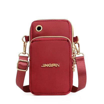 Fashionable women's crossbody phone bag with multi-function pockets, headphone plug, and stylish decorations