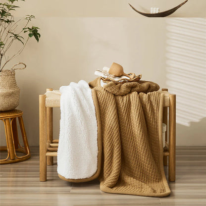 Cozy and stylish cotton plaid throw blanket in classic colors, perfect for adding warmth and charm to any living space