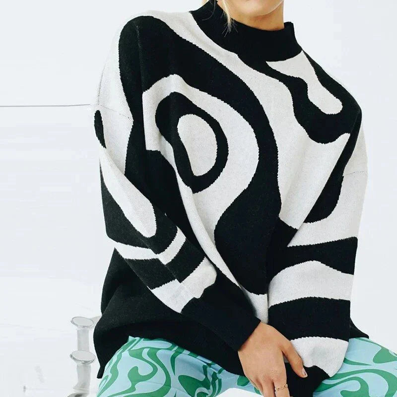 A woman wearing a stylish, striped turtleneck oversized sweater in a relaxed, comfortable fit.
