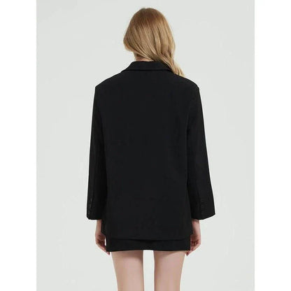 Elegant women's black blazer coat with a turn-down collar, single-breasted closure, and practical pockets for a polished, professional look.